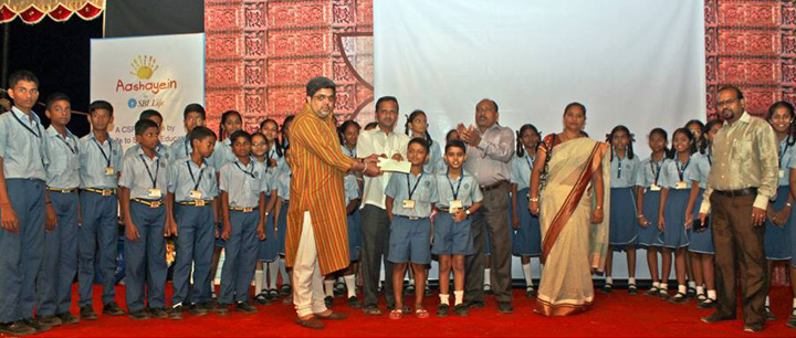 Scholarship being distributed to the students